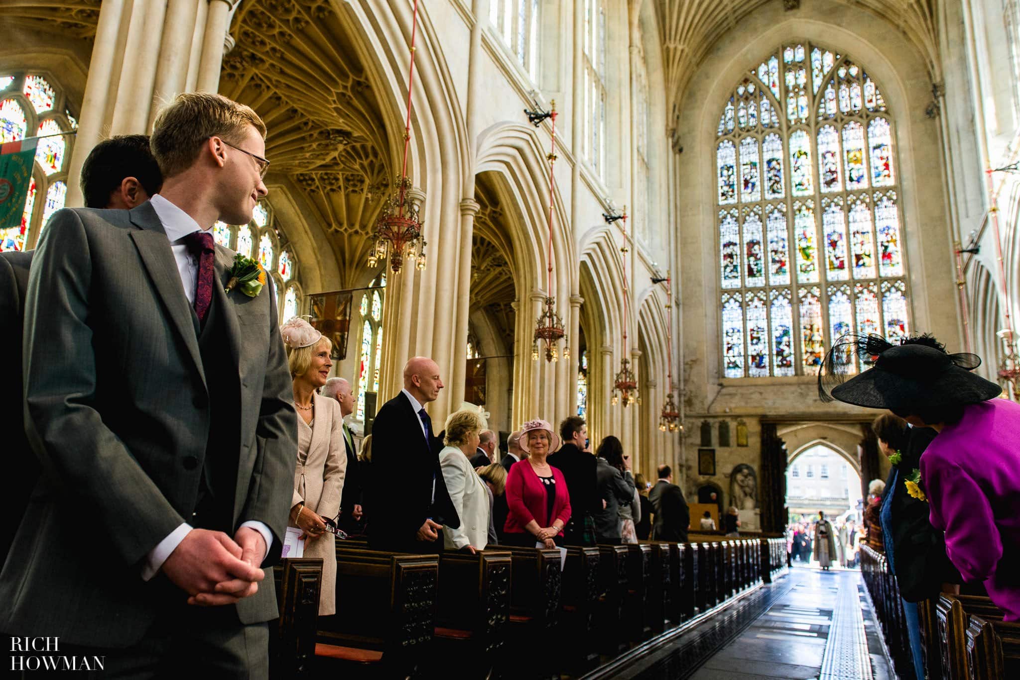 Wedding at Bath Abbey | Bath Guildhall Wedding Reception 14 The Groom looks back down the aisle for the arrival of his bride
