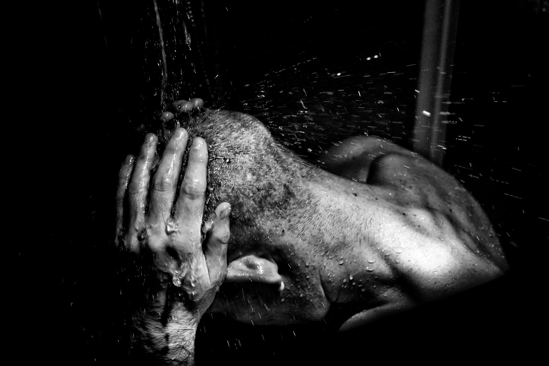 Documentary wedding photograph of the groom getting ready before his wedding at the Greath Tythe Barn Tetbury