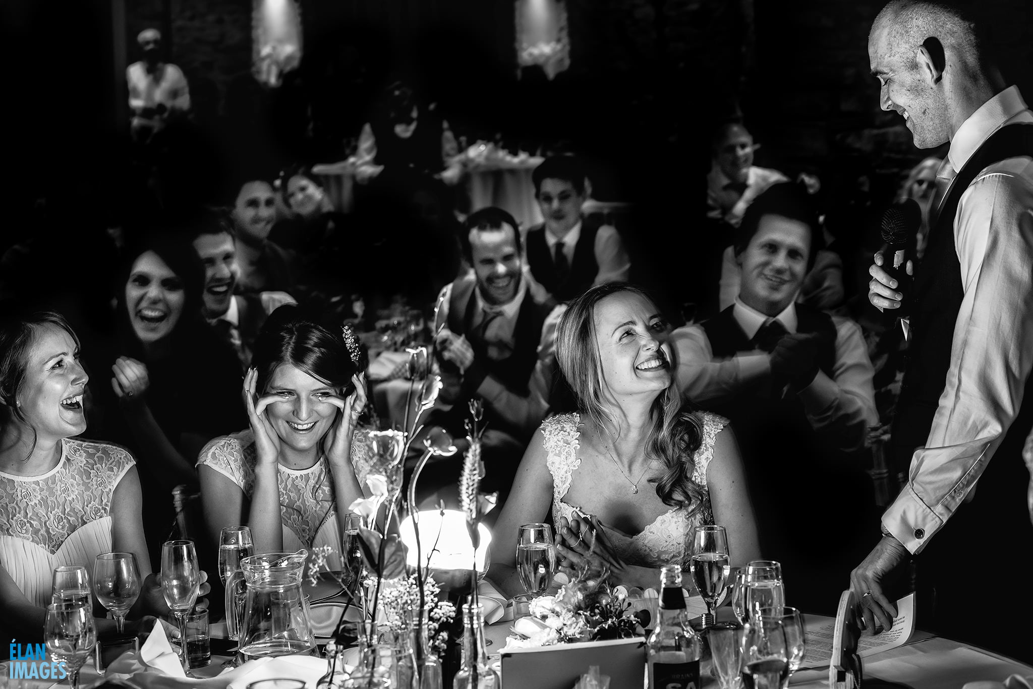 Great Tythe Barn Wedding Reception - Bride and Groom laughing with guests