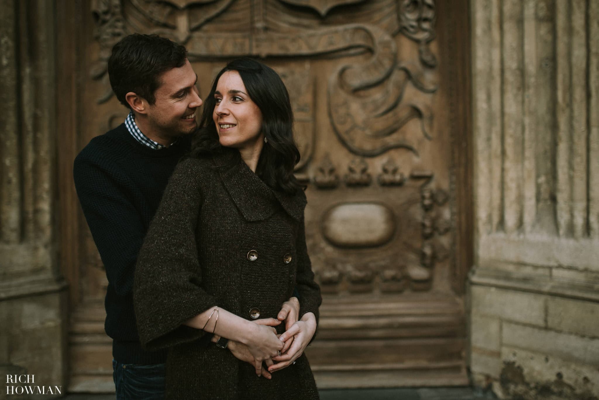 Couple enjoying their engagement Photo Shoot ouside Bath Abbey in Somerset
