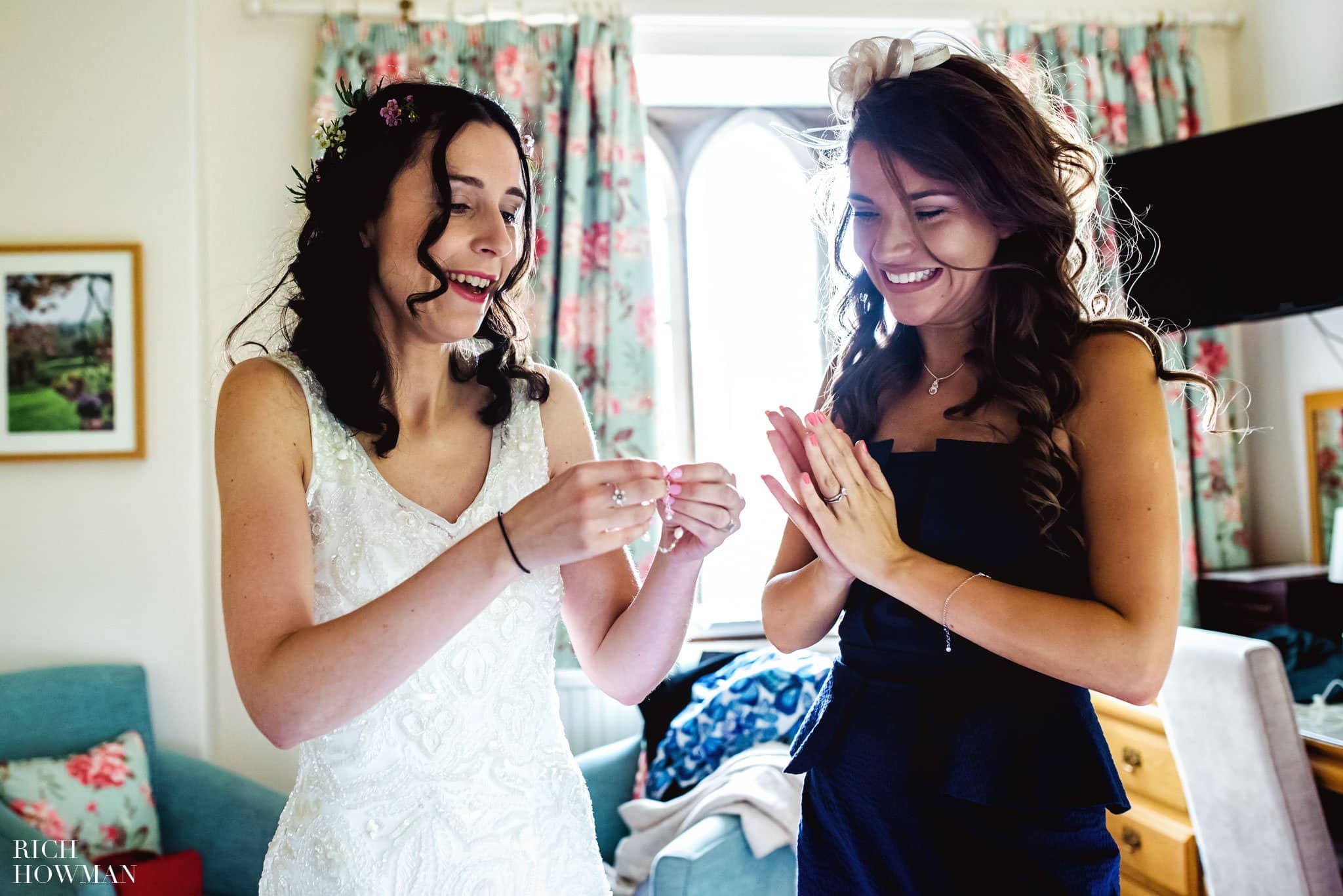 Bride end her maid of honour laughing
