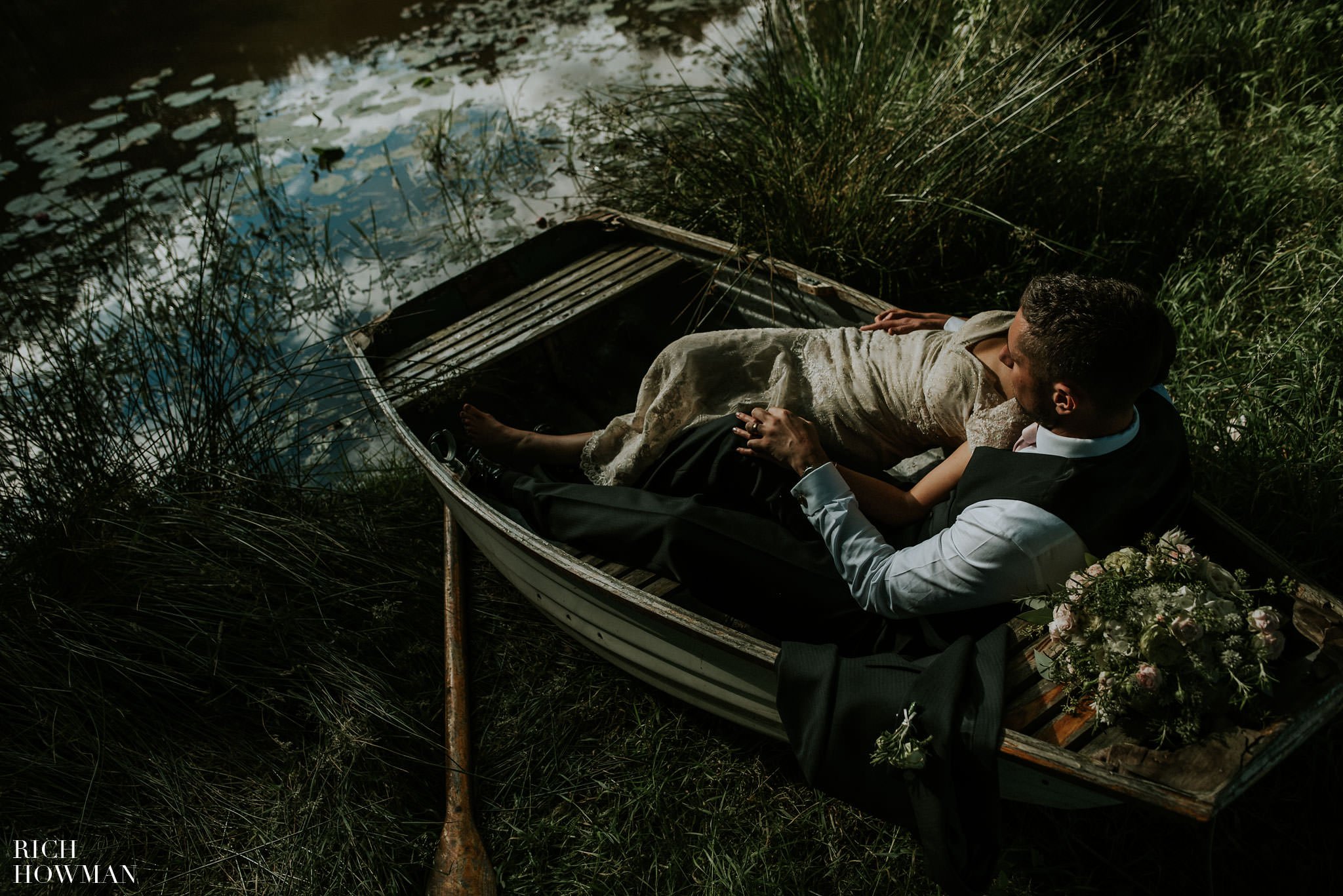 Relaxed wedding photograph of the happy couple in the fields at Iscoyd Park in Wrexham