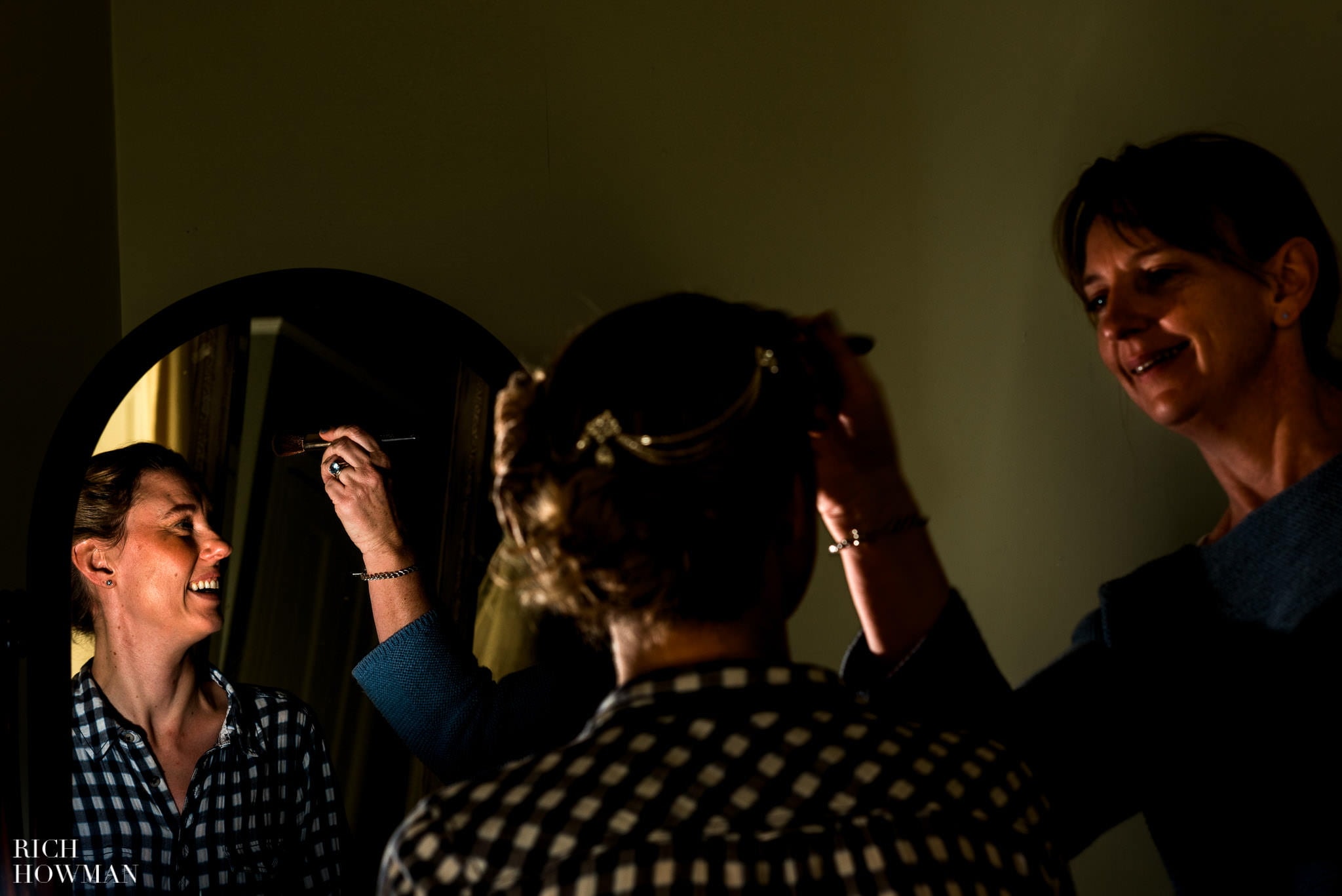 Pennard House Wedding 8 Make up artist working on the bride at Pennard House